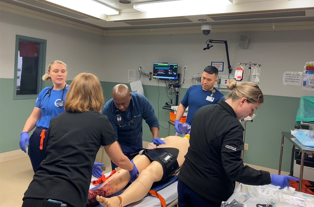 The new Navy team cares for a patient during a simulation at the Penn Simulation Center.